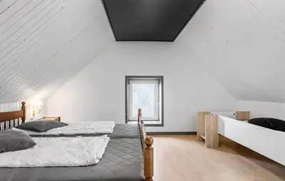 two beds in a room with white walls at Awesome Home In Øster Assels With Wifi in Øster Assels