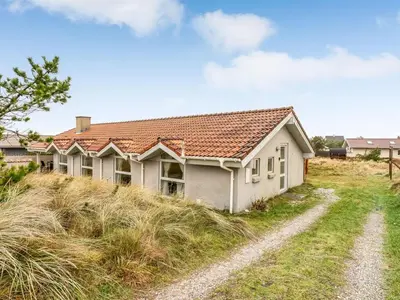 a house on top of a grassy hill at Holiday Home Annemone - 600m from the sea by Interhome in Torsted