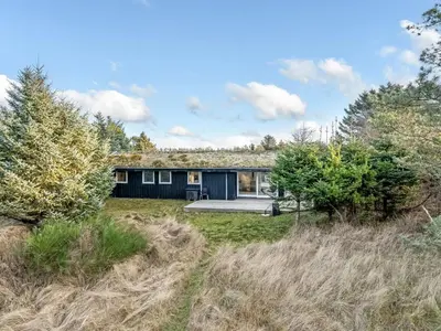 a house in the middle of a field at Holiday Home Baldo - 800m from the sea by Interhome in Blokhus