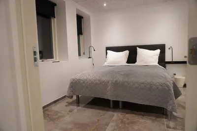 a bedroom with a bed with two pillows at Birkelse Hotel og Kro in Birkelse