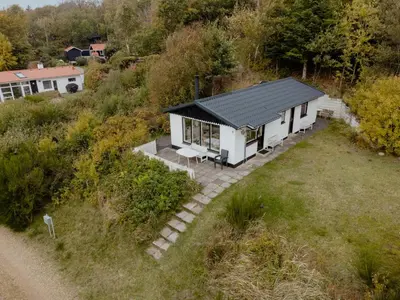 an overhead view of a white house with a black roof at Summer House With Panoramic Views Of The Limfjord in Lihme