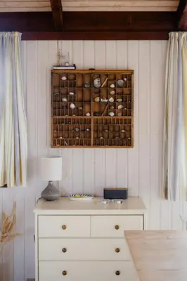 a white dresser with a lamp on top of it at Family Home In Heather-Clad Landscape in Fjerritslev