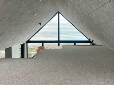 a staircase in a building with a large window at Panoramic Views Of Venø Bay At Handbjerg Marina