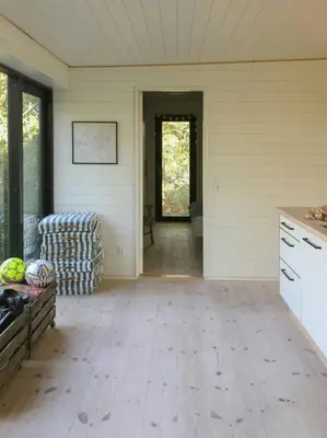 an empty room with a kitchen and a living room at Architect-Designed House By Limfjord in Thyholm