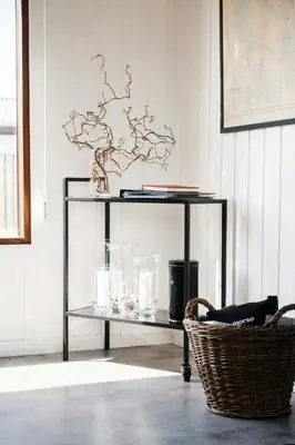 a glass shelf with items on it in a room at Architect-Designed House Close To The North Sea in Vestervig