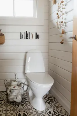 a bathroom with a white toilet and a window at Grandma's House By Limfjord And Fur in Roslev