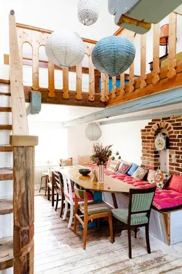 a dining room with a table and chairs at Magical Farm House Right Next To The Sea in Lemvig