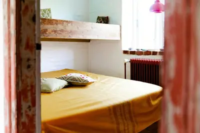 a bunk bed with two pillows on it in a room at Magical Farm House Right Next To The Sea in Lemvig