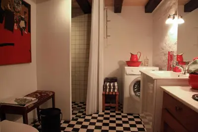 a kitchen with a washing machine and a sink at Alt det bedste mellem hav og fjord - en hel bolig in Brovst