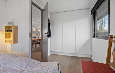 a bedroom with a bed and a window and a table at Amazing Home In Spøttrup With Wifi in Lihme