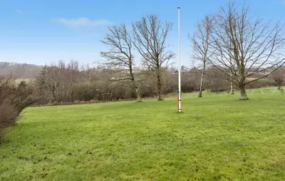 a field with a pole in the grass at Amazing Home In Spøttrup With Wifi in Lihme