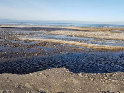 a beach with a large body of water at 6 person holiday home in Brovst in Brovst