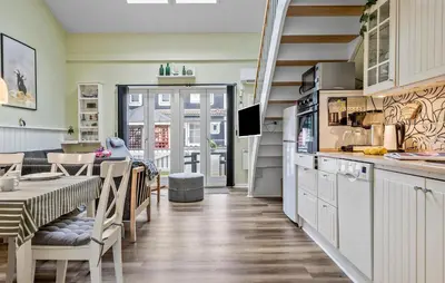 a kitchen and dining room with a table and chairs at Gorgeous Home In Vestervig With Sauna in Vestervig