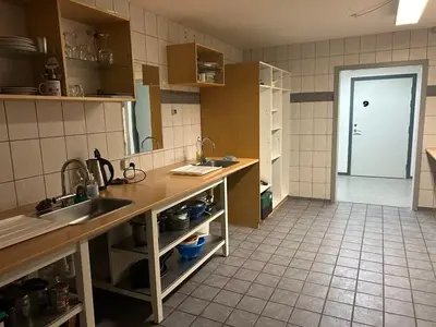 a kitchen with a sink and a counter top at Hostel Mors in Erslev