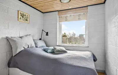a bed in a room with a window and a bed sidx sidx sidx at Gorgeous Home In Vinderup With Wifi in Vinderup