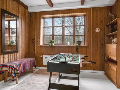 a room with a chess table in the middle of it at Holiday Home Eva - 9km to the fjord by Interhome in Brovst