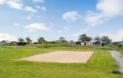 a baseball field with houses in the background at Cozy Home In Vestervig With Sauna in Vestervig