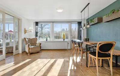 a dining room with a table and chairs at Beautiful Home In Nibe With Sauna in Nibe