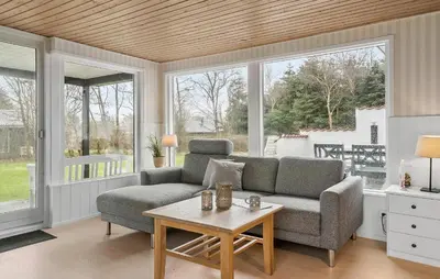 a living room with a couch and a table at Nice Home In Vinderup With Wifi in Vinderup