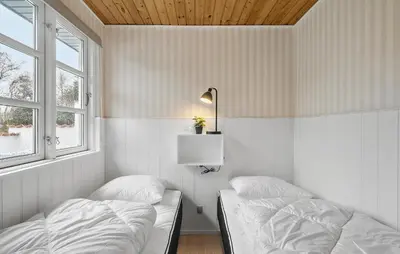 a bedroom with two beds and a lamp and two windows at Nice Home In Vinderup With Wifi in Vinderup