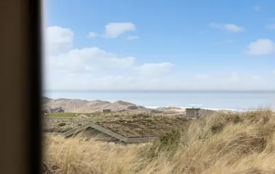 a view of the ocean from the dunes of a beach at Cozy Home In Saltum With House Sea View in Saltum