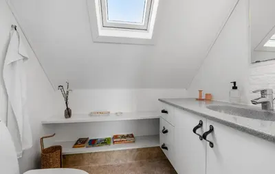 a white bathroom with a sink and a window at 3 Bedroom Cozy Home In Farsø in Farsø