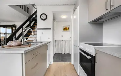 a kitchen with a sink and a stove at 3 Bedroom Cozy Home In Farsø in Farsø