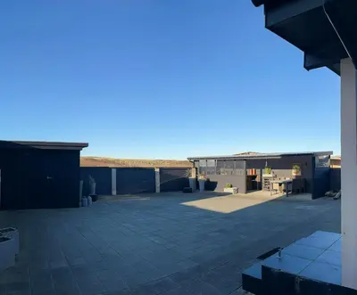 a view from the roof of a building with a patio at Charming Town House In Thyborøn Near The North Sea in Thyborøn
