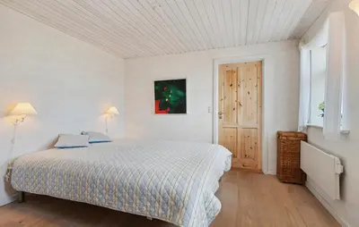 a white bedroom with a bed and a window at Nice Home In Thisted With Wifi in Thisted