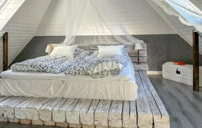 a bedroom with a large bed with a canopy at 2 Bedroom Beautiful Home In Vinderup in Vinderup