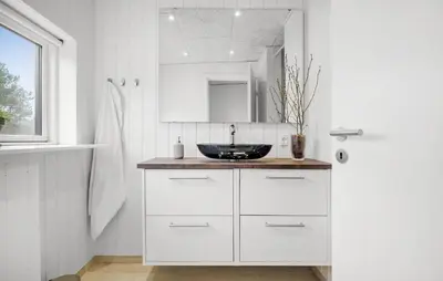 a white bathroom with a sink and a mirror at 3 Bedroom Awesome Home In Fjerritslev in Fjerritslev