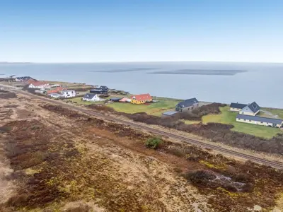 an aerial view of a small town next to the ocean at Holiday Home Nyalle - 50m to the fjord by Interhome in Struer