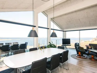 a conference room with a large table and chairs at 5 star holiday home in Løgstrup in Løgstrup