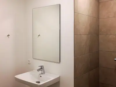a bathroom with a sink and a mirror at 5 star holiday home in Blokhus in Blokhus