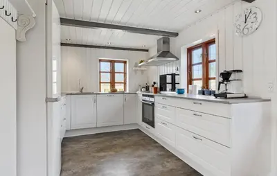 a white kitchen with white cabinets and appliances at Nice Home In Farsø With Wifi in Farsø