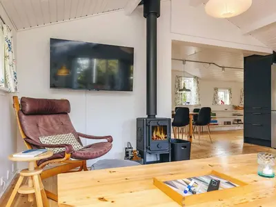 a living room with a wood stove at 6 person holiday home in Thisted in Thisted