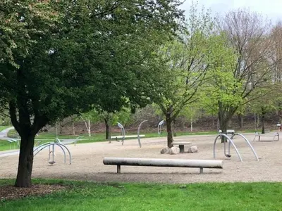 a park with benches and slides in a park at Struer Festcenter - Vest Bowl lejlighed 2 Bredgade 62 A in Struer