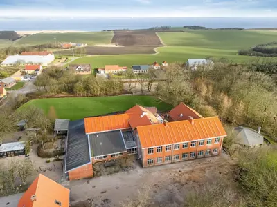 an aerial view of a house with an orange roof at Exclusive Pool Houseconference Center With Gymnasium in Erslev