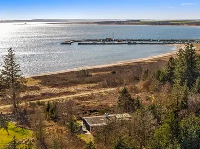 an aerial view of a beach with a pier at Lovely Holiday Home With Panoramic View Of The Fjord in Amtoft