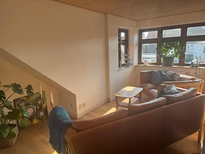 a living room with a couch and a table at Svane's Air-bnb in Nykøbing Mors