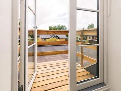 a balcony with a view of a building at 4 star holiday home in Løgstør in Løgsted