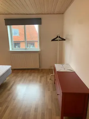 an empty room with a desk and a window at Townhouse centrally located close to Jesperhus in Nykøbing Mors