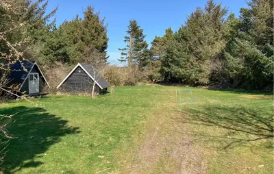 a yard with a shed and a soccer ball at 4 Bedroom Amazing Home In Hurup Thy in Sønder Ydby