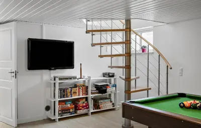 a living room with a pool table and a tv at Stunning Home In Fjerritslev With Sauna in Fjerritslev
