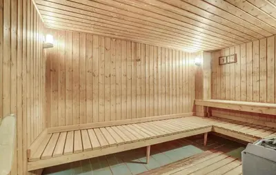 a wooden sauna with a bench in the middle at Stunning Home In Vestervig With Sauna in Vestervig