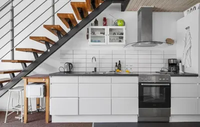 a kitchen with white cabinets and a stove at Stunning Home In Vestervig With Sauna in Vestervig