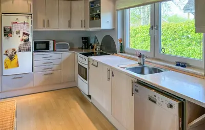 a kitchen with a sink and a refrigerator at Gorgeous Home In Spøttrup With Wifi in Spottrup