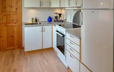 a kitchen with white appliances and a white refrigerator at Lovely Home In Fjerritslev With Wifi in Fjerritslev