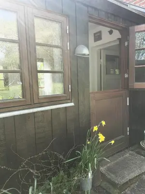 a house with a door and a window and a plant at PipOp - the place where you find your soul again in Struer