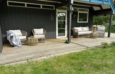 a deck with two chairs and a table on a house at Hidden Gem By Thy National Park